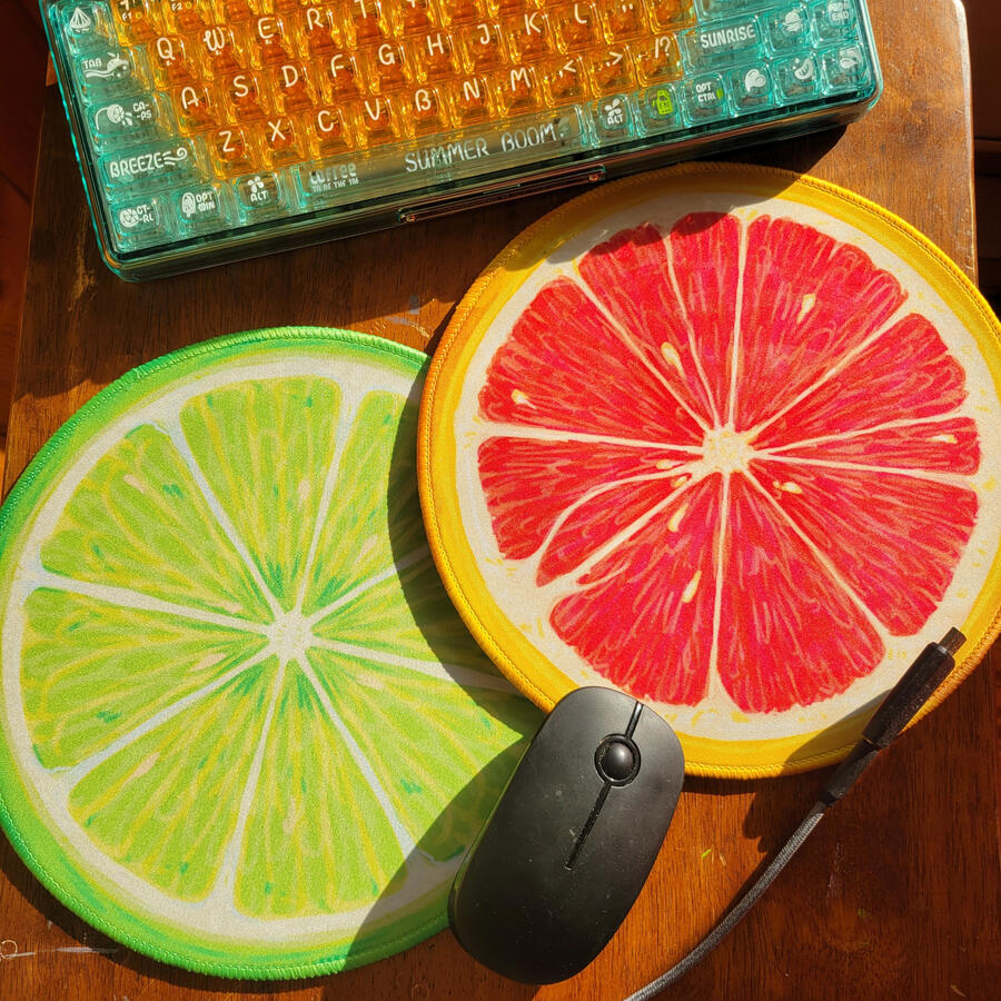 25 cm round mousepads w/ serged edges and high-grip backing